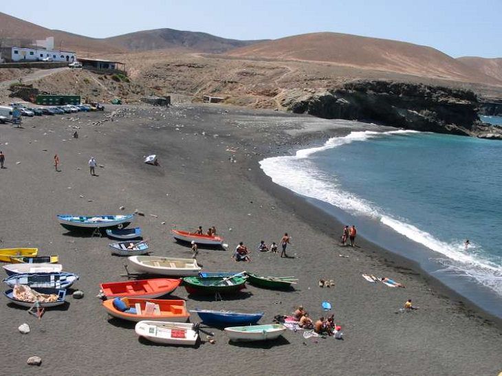 Beautiful sights, beaches, geological formations and cultural activities of Fuerteventura, the oldest and second largest of the Canary Islands, The Black Sand Beach at Ajuy
