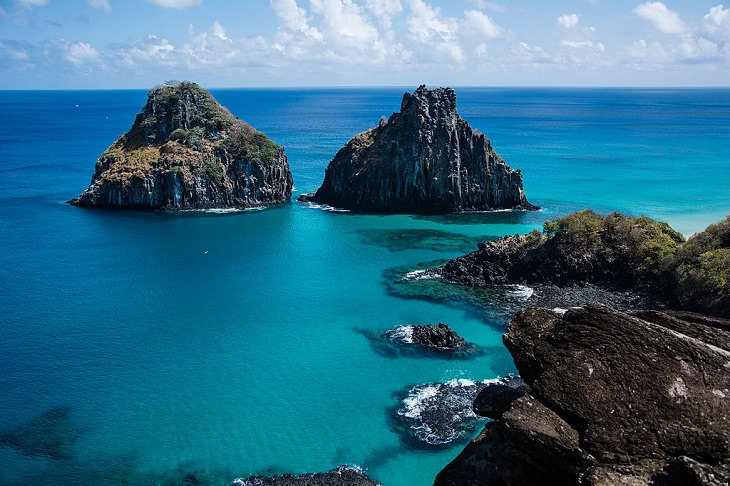 Beautiful historic sights, ruins and the many beaches of Fernando de Noronha in Pernambuco, Brazil, UNESCO World Heritage Site since 2001, The Two Brothers Rock (Morro Dois Irmãos), off the coast of the main island