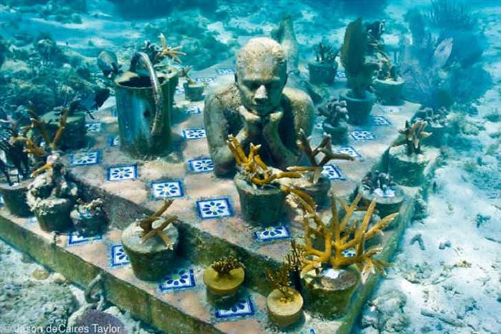 Unique and unconventional statues, sculptures and art installments made from a variety of different materials, Underwater Sea Statuettes, made from a cement finish that promotes the growth of coral, by Jason deCaires Taylor