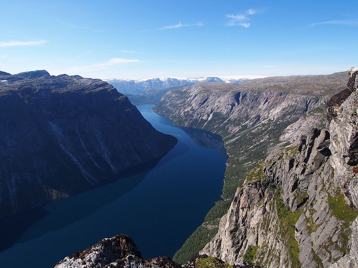 Sights from the popular hiking trail to the rock formation and cliff Trolltunga, near the town of Odda in Norway, Lake Ringedalsvatnet