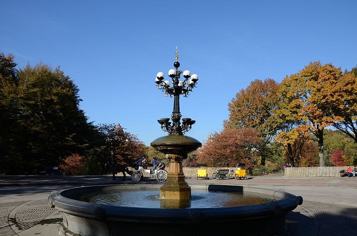Buildings, attractions, statues, monuments, tributes and memorials found in New York City’s Central Park, Cherry Hill Fountain, located at Wagner Cove, found south of the Parks Lake