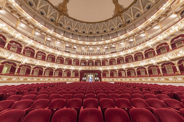 Photographers from travel photographer Richard Silver of the interiors of historic theaters, opera houses and centers for performing arts, taken from the stage, Teatro Petruzzelli, Bari, Italy