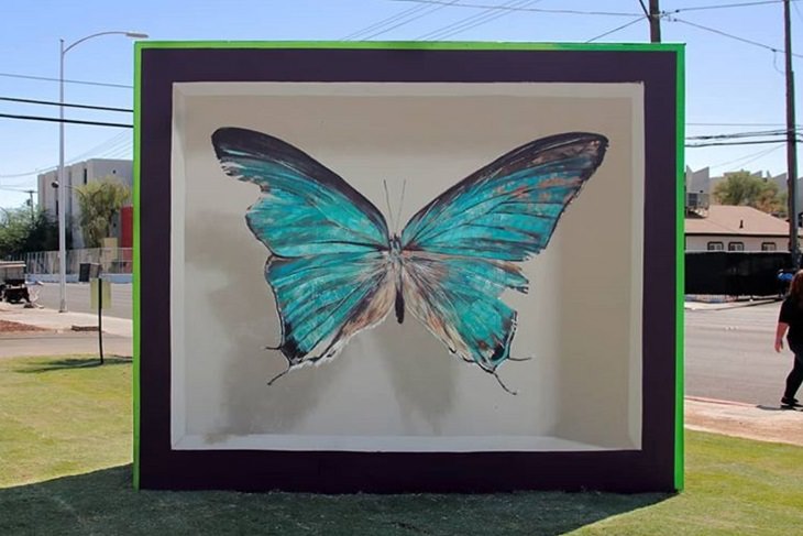 Hyper realistic butterfly specimen exhibits and displays painted as murals by street artist Mantra across the world, Las Vegas, USA for the Life is Beautiful Festival
