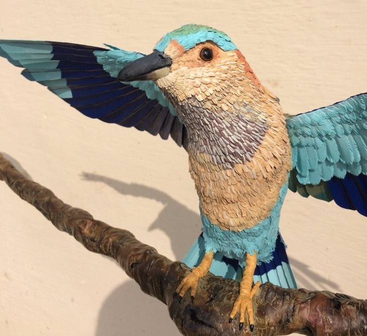 Beautiful and colorful bird sculptures made from paper, paper birds, by Indian artist Niharika Rajput, An up-close view of an Indian Roller