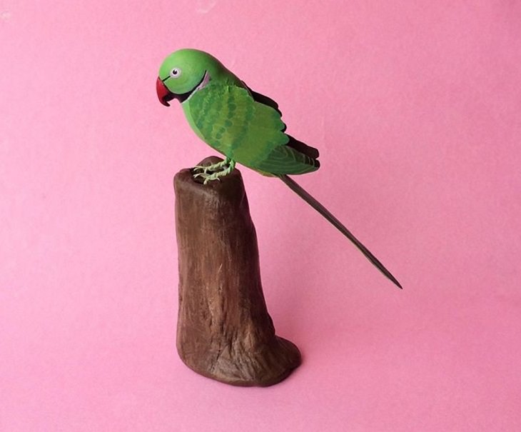 Beautiful and colorful bird sculptures made from paper, paper birds, by Indian artist Niharika Rajput, An Indian Ring-Necked Parakeet table top