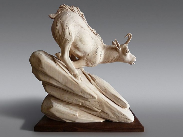 Realistic Animal Sculptures carved out of wood by woodworking Italian artist Guiseppe Rumerio, mountain goat
