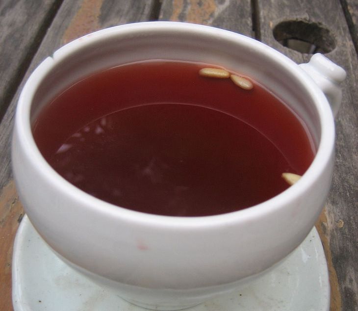 Recipe for healthy Korean traditional cold fruit tea, good for digestion, Sujeonggwa, bowl of tea