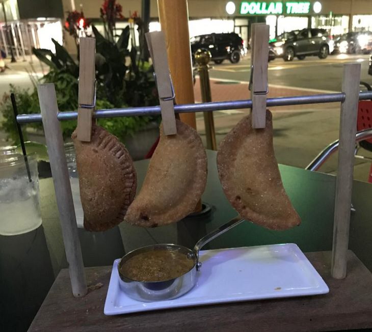 Hilariously creative replacements for plates, empanadas hanging on a clothesline with pins