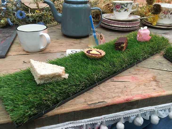 Hilariously creative replacements for plates, sandwich and snacks on platter of grass