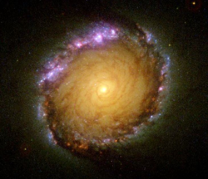 Photo gallery of the most unusual and strangely beautiful galaxies found in the universe and across space, Galaxy NGC 1512, a galaxy known for high volumes of starbursts, the birth of new clusters of stars