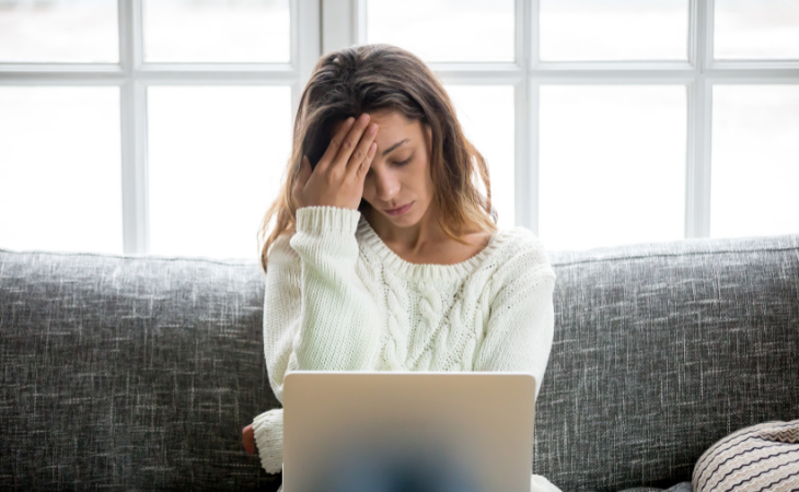 Woman frustrated with her laptop