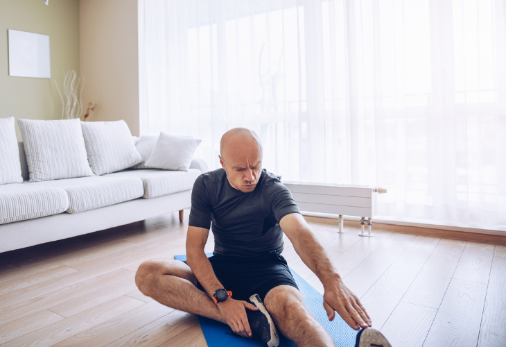 man stretching his hamstrings