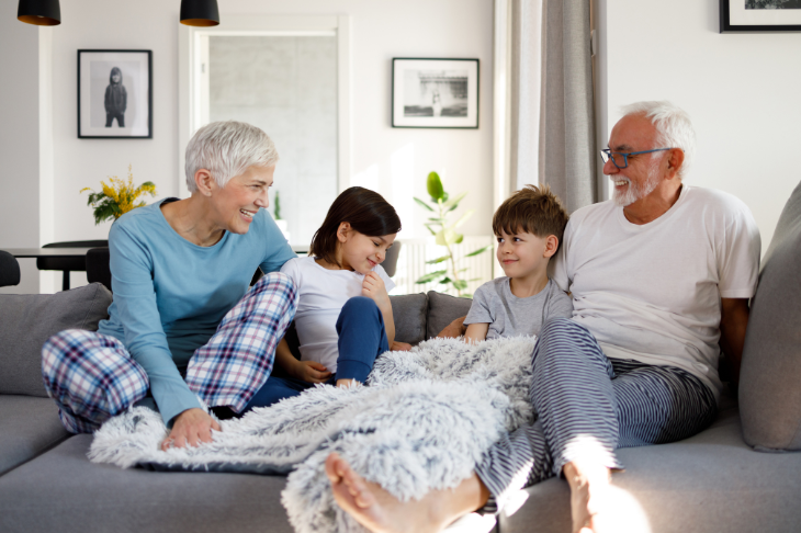 grandparents laughing with grandchildren