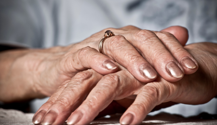senior woman hands with polish