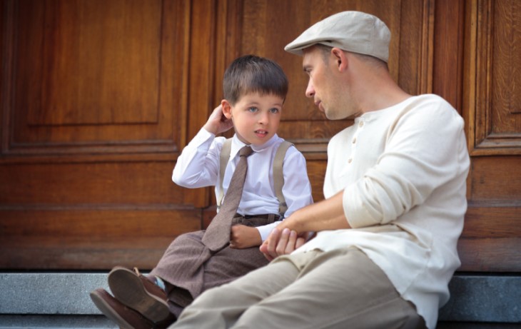 father and boy talking