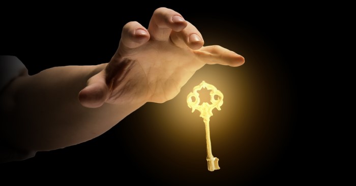 ownership effect hand reaching to a golden key