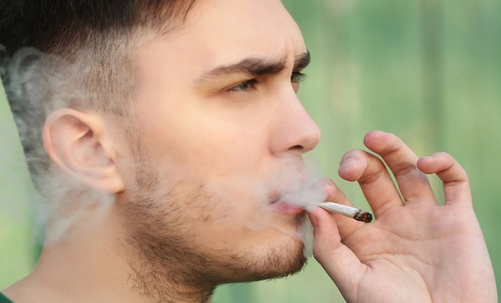 man smoking a joint