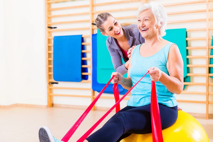 mature woman exercising in gym