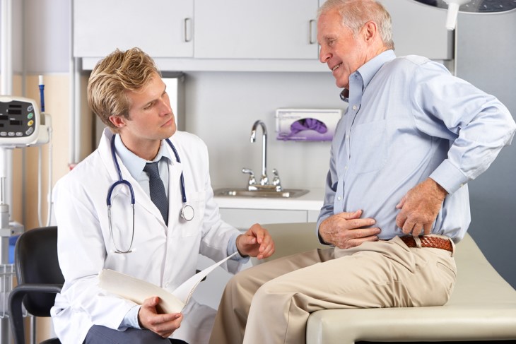 doctor with patient needing hip replacement