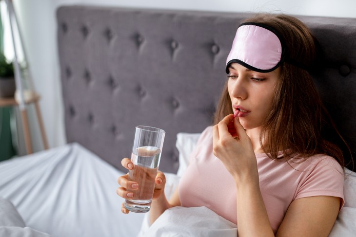 woman taking melatonin