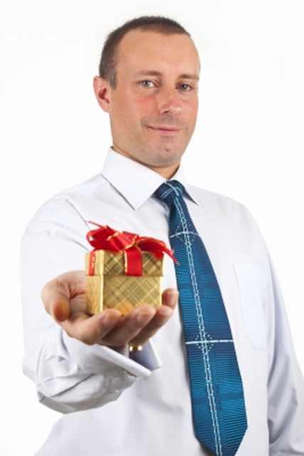 man handing out a gift