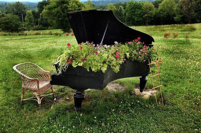 Recycled Furniture piano used to grow plants in garden