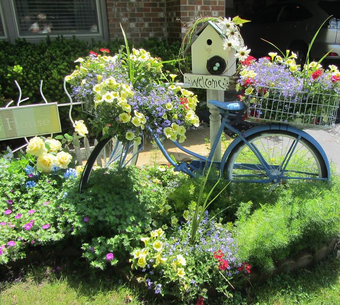 Recycled Furniture old blue bicycles made part of a garden 