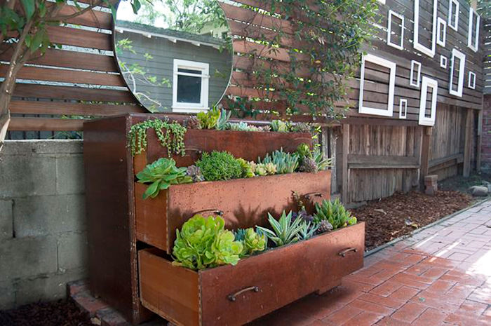 Recycled Furniture  wood closet filled with plants in garden