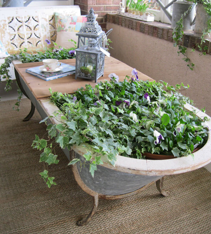 Recycled Furniture old bathtub full of plants used as part of garden