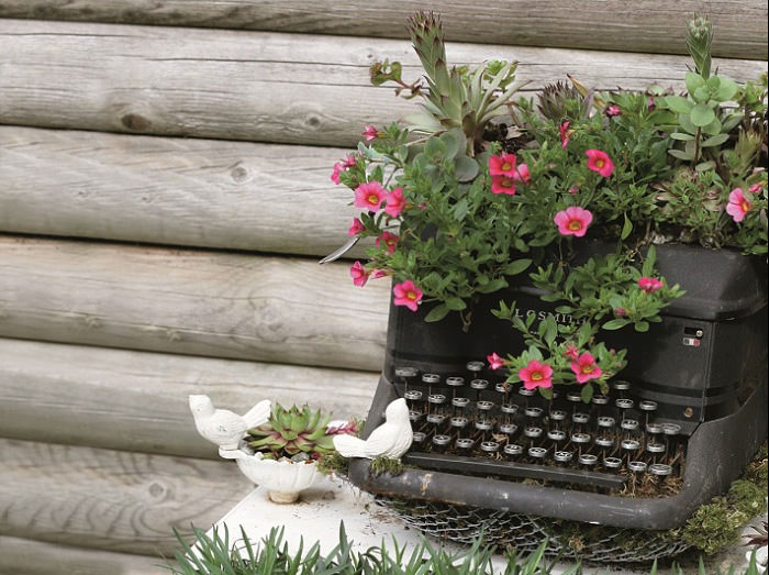 Recycled Furniture typewriter with flowers in it outside