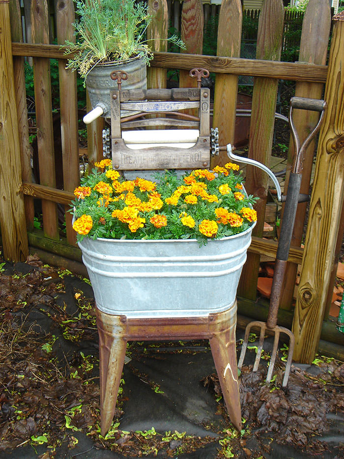 Recycled Furniture vintage washing machine full of plants in the garden