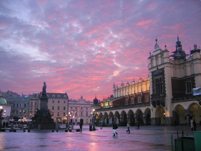 Poland Krakow’s Main Market Square at sunset with purple sky