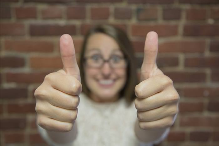 benefits of using google drive: women shows thumbs up