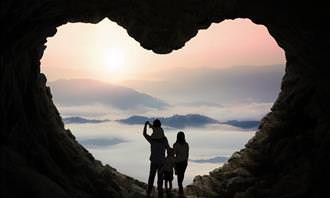 family in heart-shaped cave