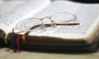 glasses on Bible