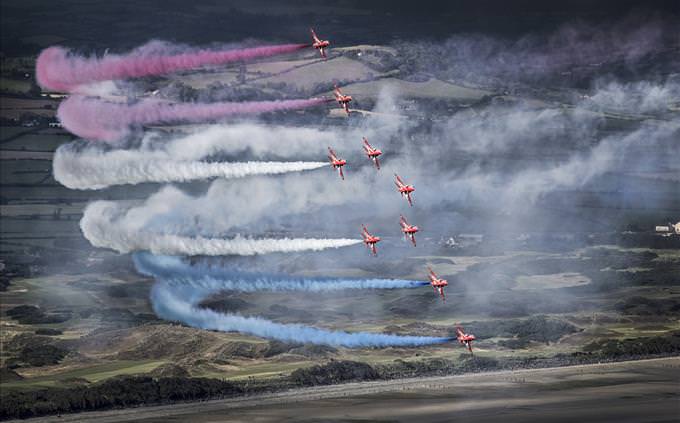 Red Arrows releasing colored smoke