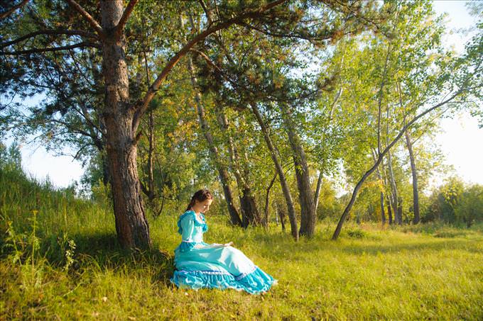 woman in Victorian dress outdoors