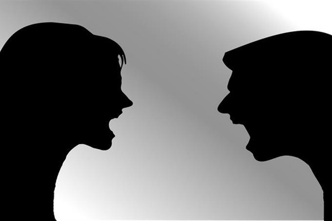 Shadow of man and woman laughing at eachother