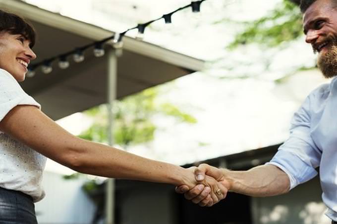 man and woman holding hands