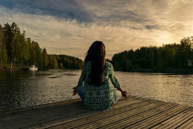 woman sitting on a dock