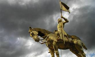 A statue of Joan of Arc riding a horse