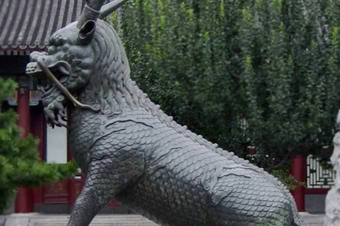 statue of a dragon with hooves