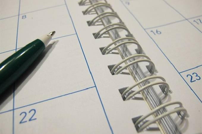 a pen laying on a calender