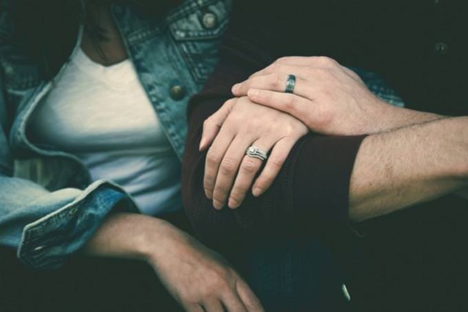 a man and a woman holding hands