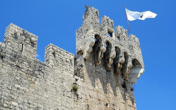 A castle with a flag raised over it