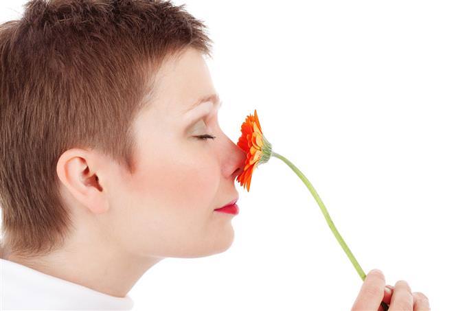 Woman smelling flower