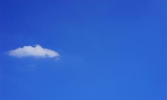 Blue skies with one white cloud
