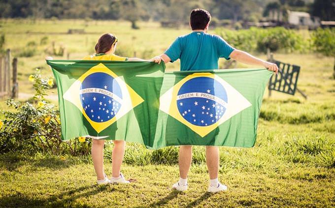 people with brazilian flag