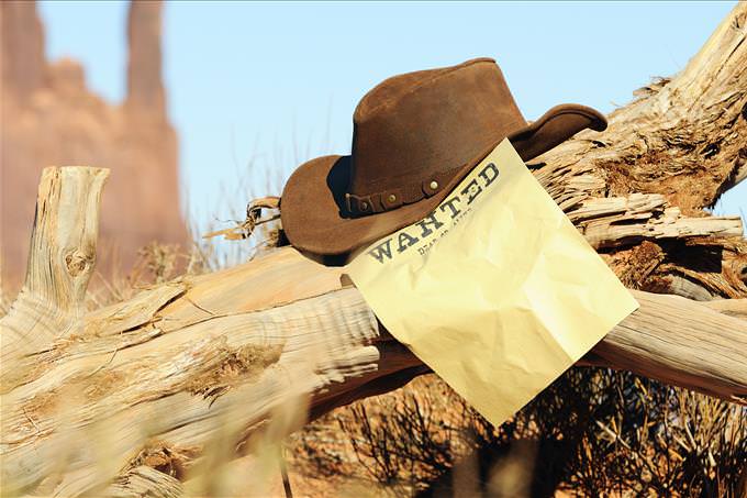 wanted poster and cowboy hat