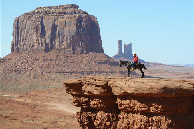 cowboy on horse in canyon